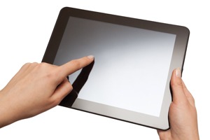 man scrolling on tablet device